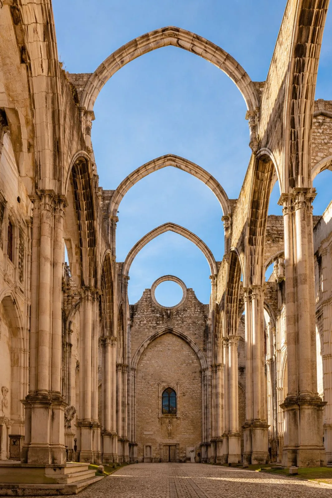Roofless Carmo Convent arches against the sky