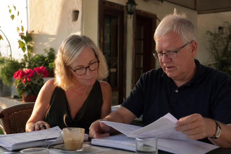 Founder-led Portugal tax advisory meeting with documents on a table