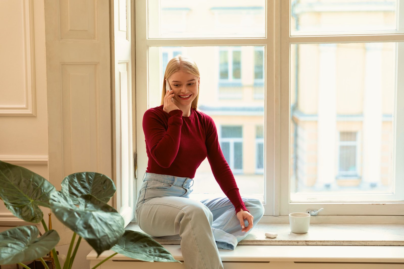smiley-woman-talking-phone-medium-shot 1